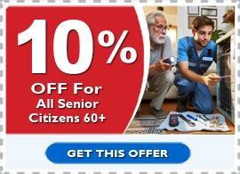 The image is an advertisement offering a discount specifically for senior citizens. It features a large red tag on the left with Ten Percent OFF For All Senior Citizens 60 years or older in bold white text. On the right is a photograph of a senior citizen and an HVAC technician at his home in San Ramon, CA, where the technician shows why his AC unit is malfunctioning to the senior citizen next to an air conditioning unit. Tools are spread out on the floor. Below the image, a GET THIS OFFER button suggests the viewer can click on it to take advantage of the discount.