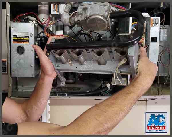 Furnace repair technician performing heating system maintenance in San Ramon