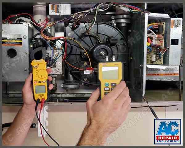 AC Repair San Ramon technician using multimeter to diagnose furnace electrical components