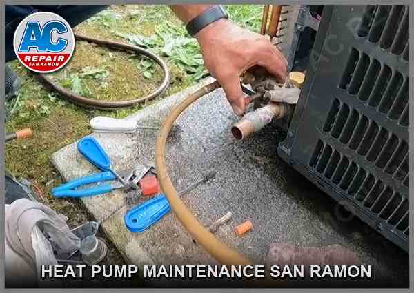 Our maintenance technician checks the heat pump system and cleans the outdoor unit coils and compartments in a customer's San Ramon, CA, home.